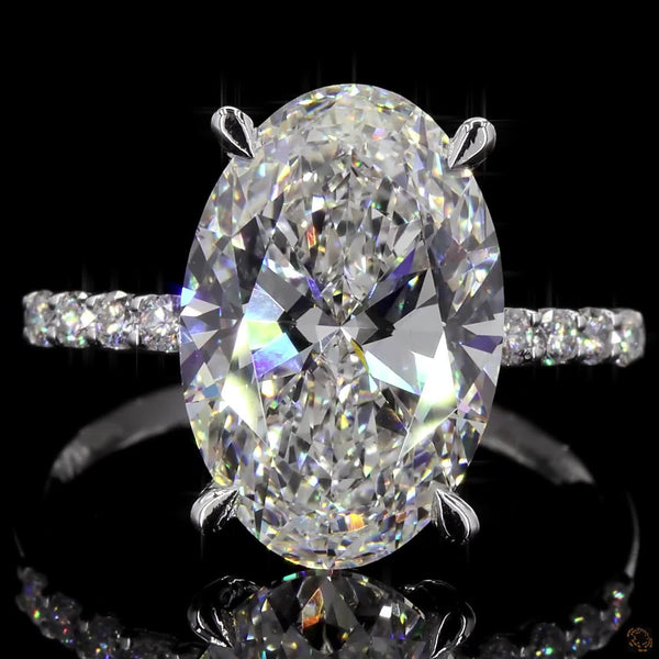 The Exquisite White Gold Oval & Round Diamond Ring