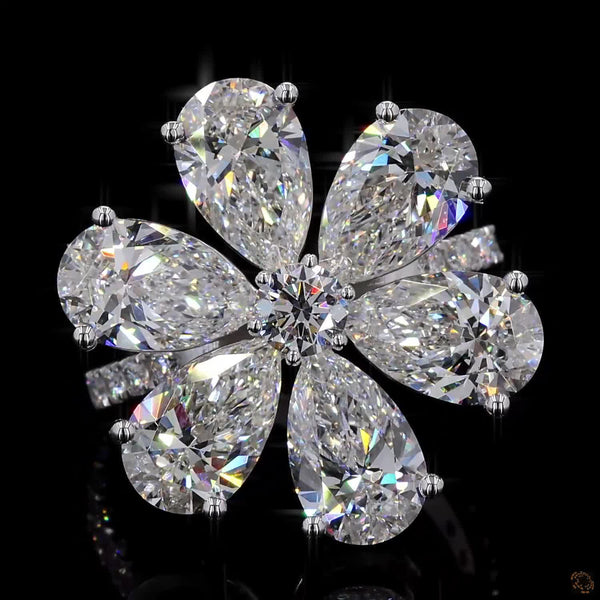 The Radiant White Gold Pear & Round Diamond Ring