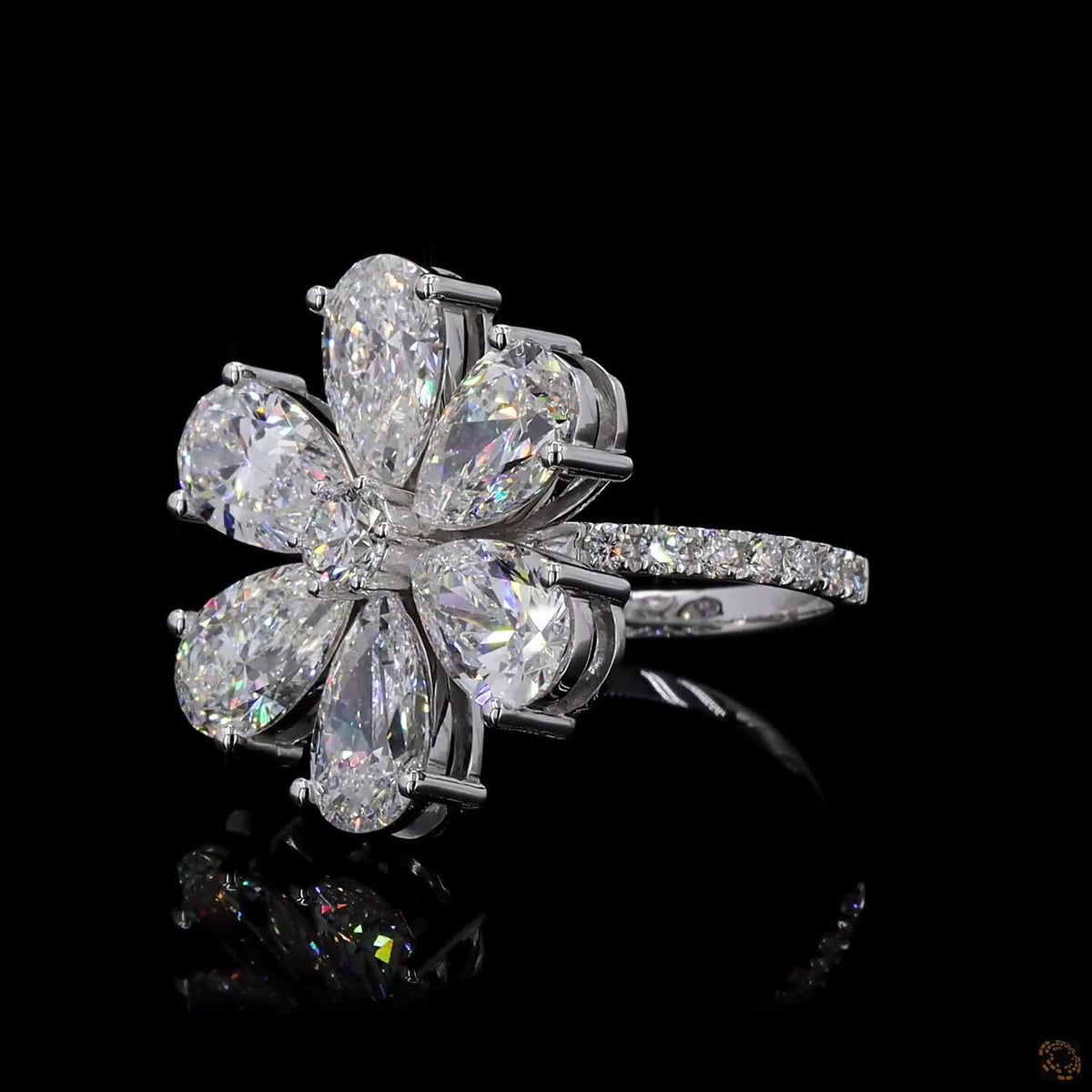 The Radiant White Gold Pear & Round Diamond Ring